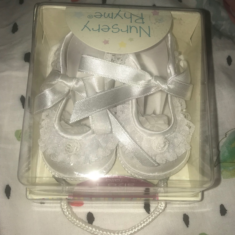 NWT White size 1 baby satin shoes with ruffles.